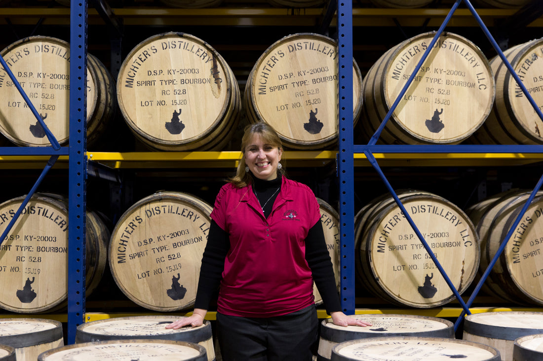 Andrea in front of barrels