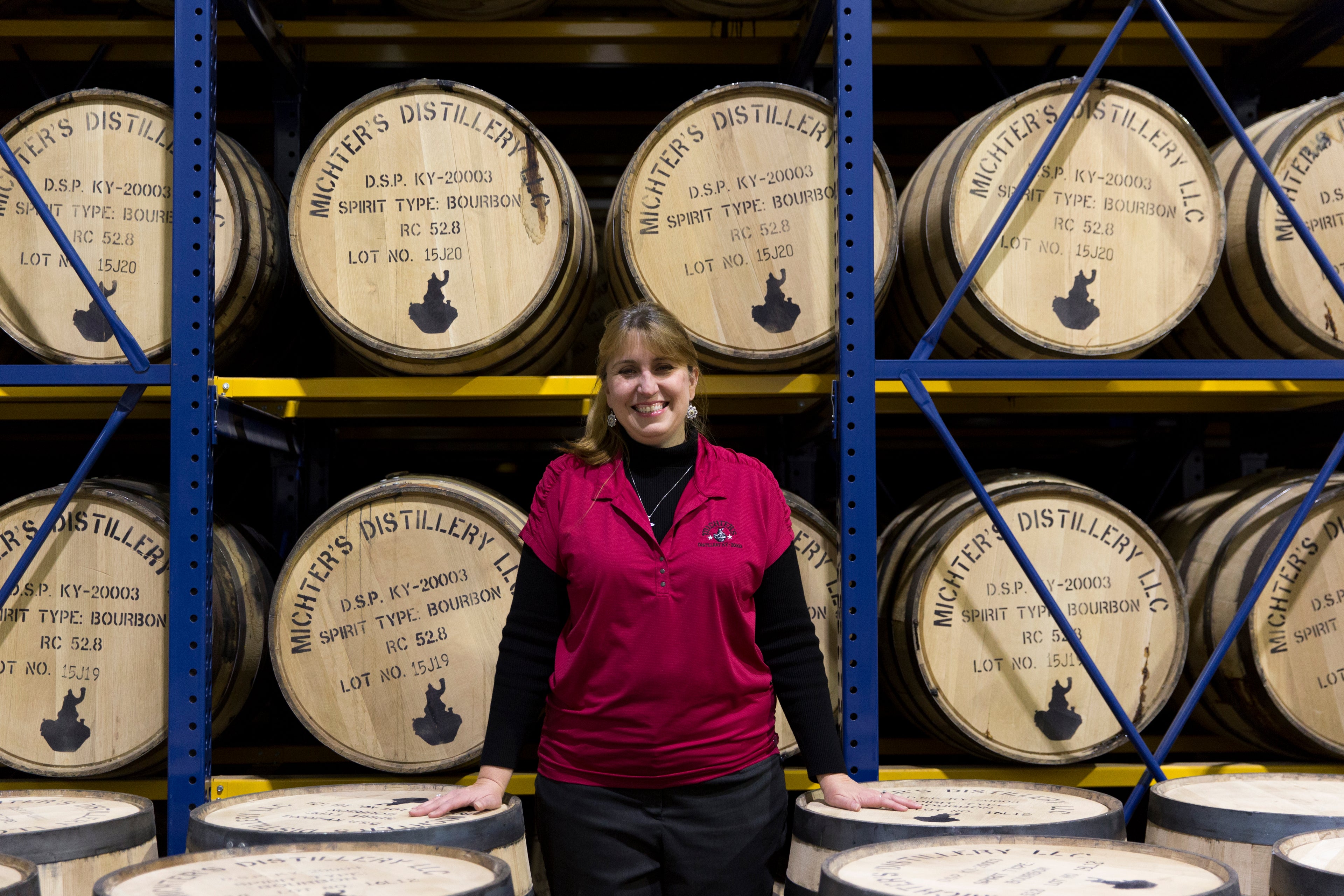 Andrea in front of barrels