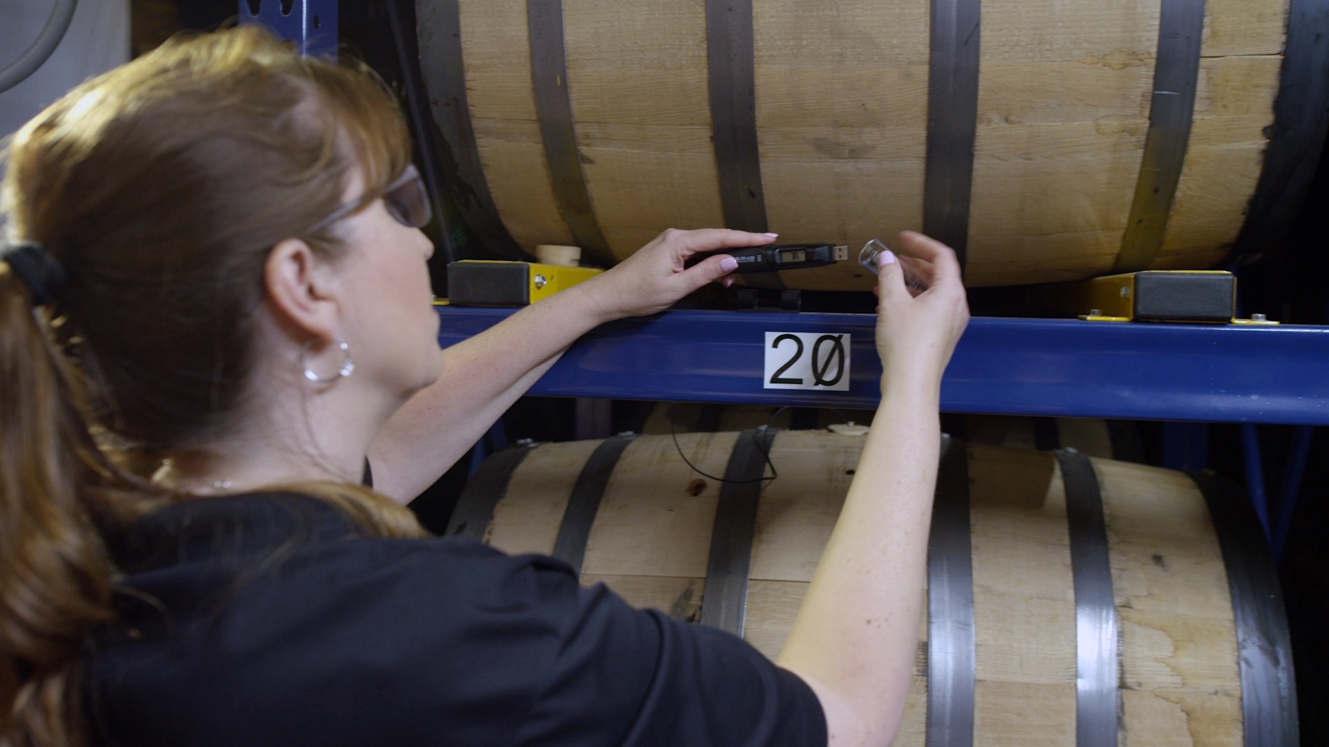 Andrea inspecting a barrel