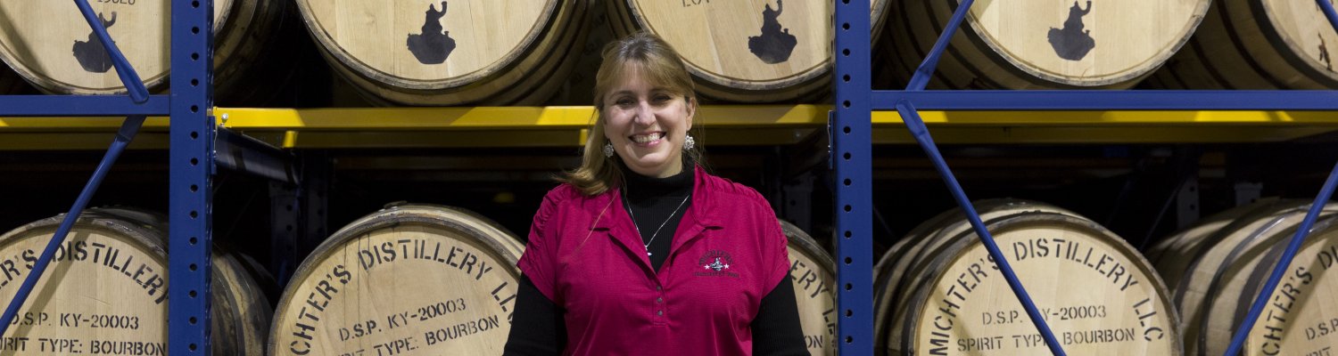 Andrea in front of barrels