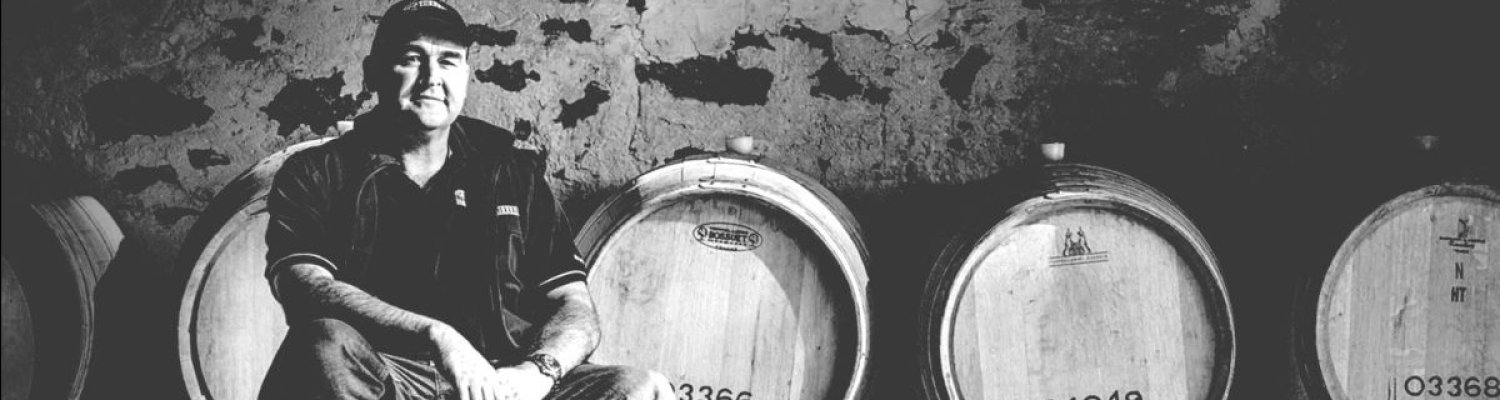 A winemaker in the barrel store